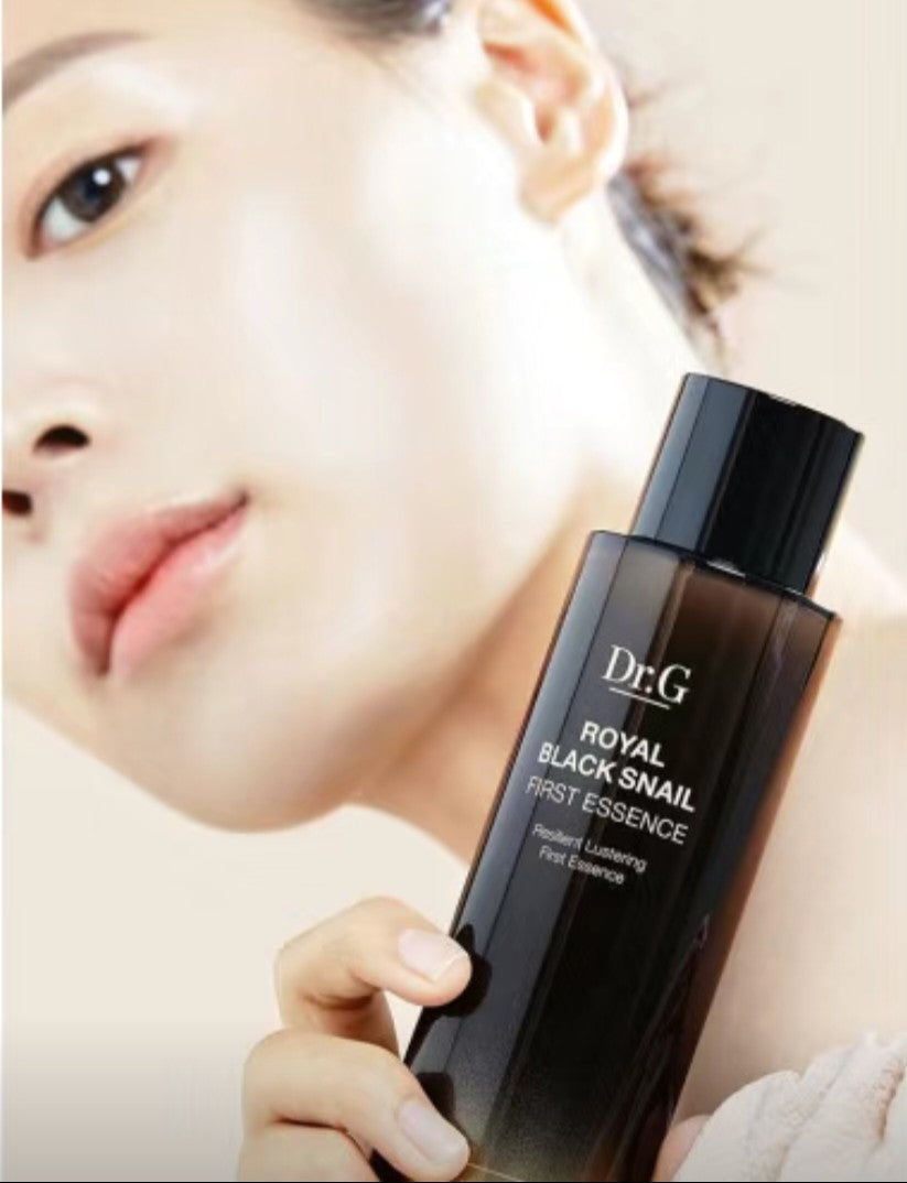 “Woman applying Dr. G Lifting and Firming Essence to face – skin brightening skincare