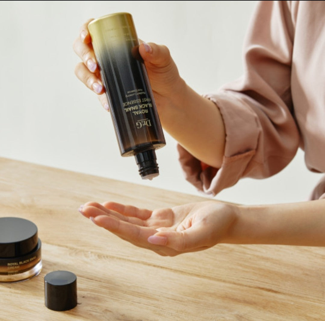 “Applying Dr. G Firming Essence – snail mucin essence for glowing, elastic skin”