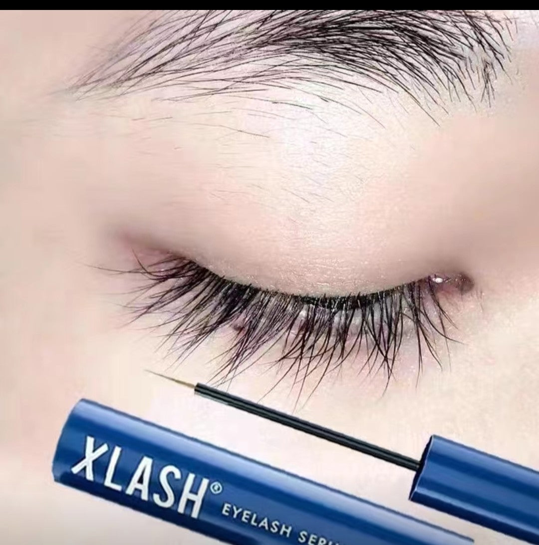 Close-up of eye with long, thick eyelashes after using Xlash Eyelash Serum in blue packaging
