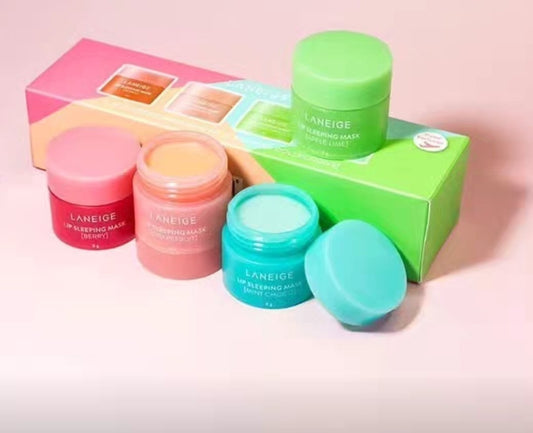 LANEIGE Lip Sleeping Mask Mini Kit with four colorful jars in pink, green, blue, and coral, placed next to matching boxes