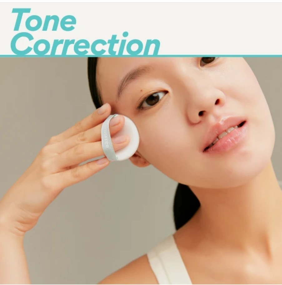 Person applying a cosmetic product with 'Tone Correction' text above.