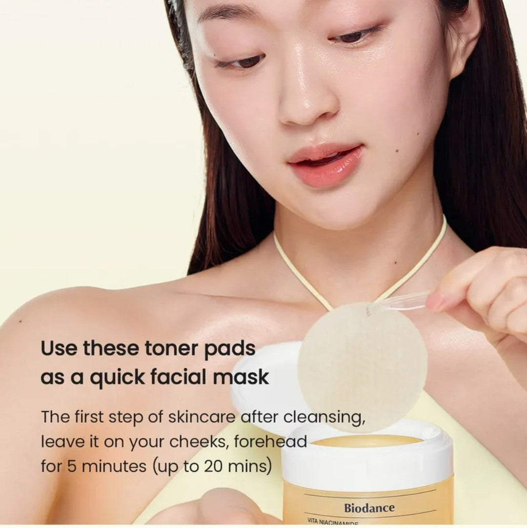 Woman using toner pads with Biodance product on a beige background