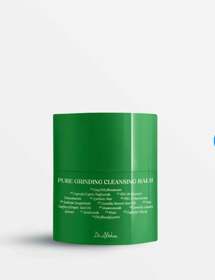 Green jar of 'Pure Grinding Cleansing Balm' on a white background