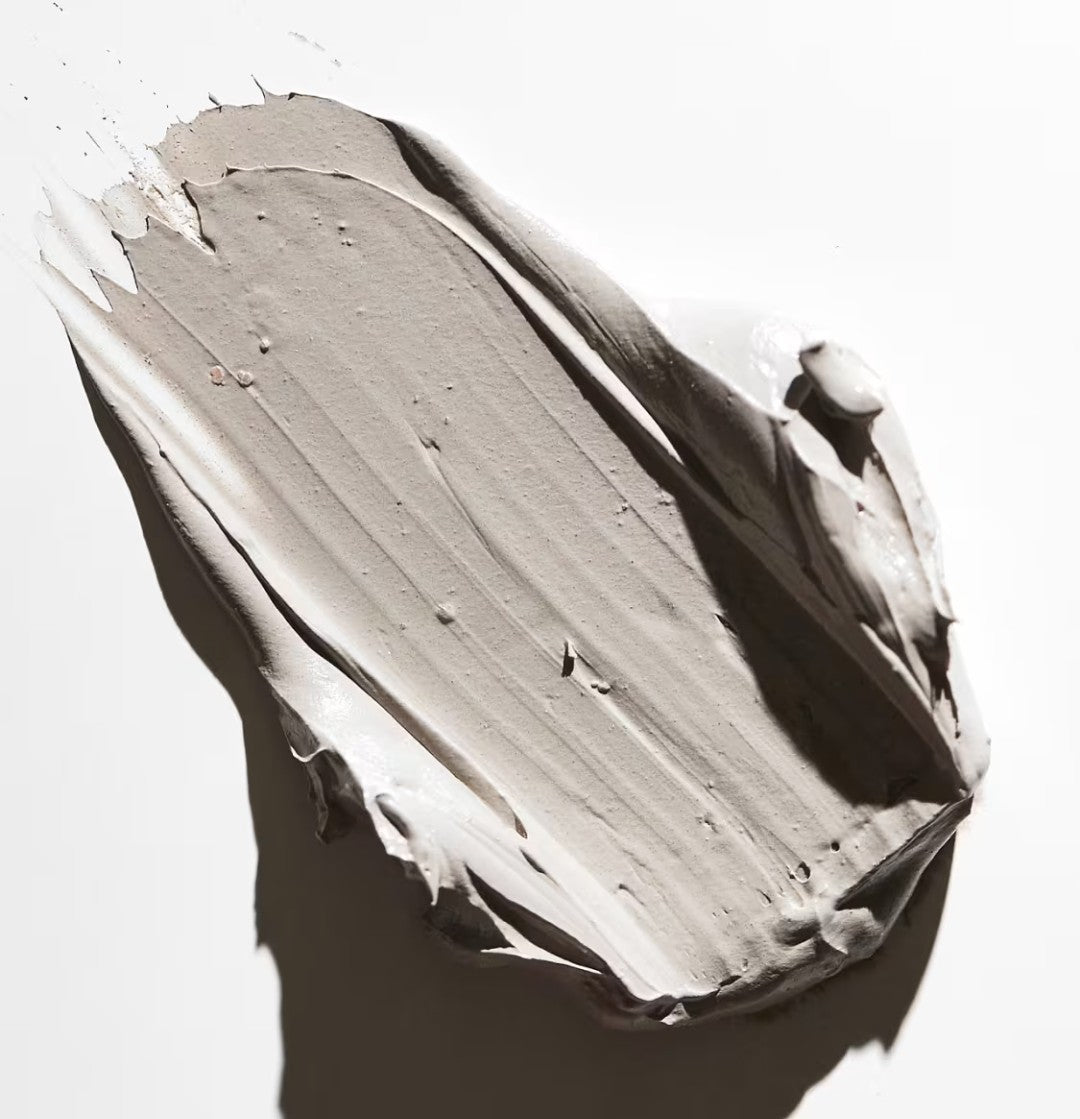 Close-up of a swatch of beige paint on a white background