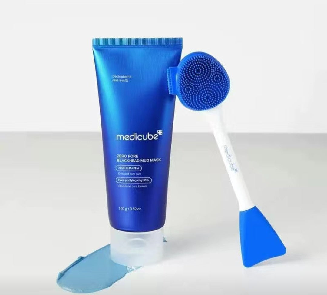 Blue tube of medicube zero pore blackhead mud mask with a brush on a white background