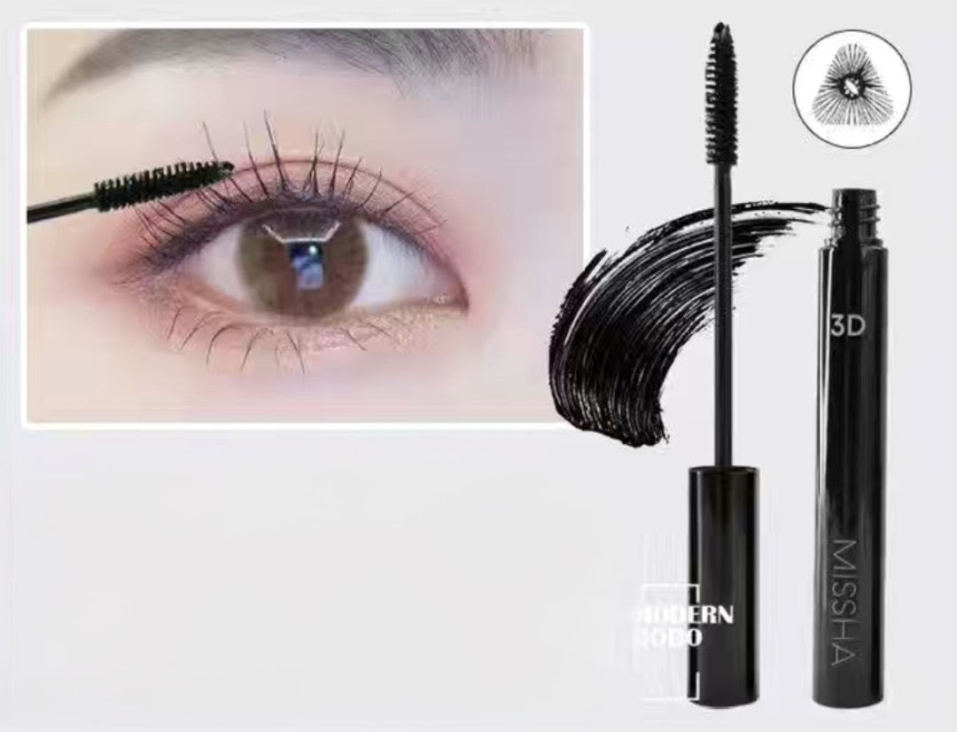 Woman applying Missha 3D Mascara for long, curled lashes