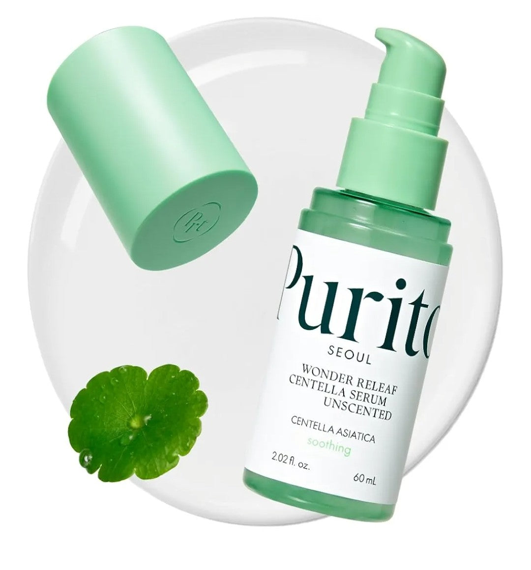 Purito skincare serum bottle with green cap and centella asiatica leaf on a white background