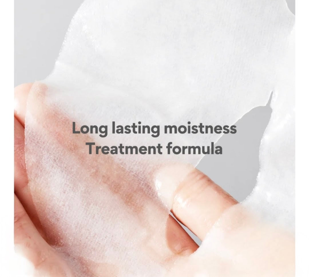Close-up of a hand with a product application, text 'Long lasting moistness Treatment formula' on a light background.
