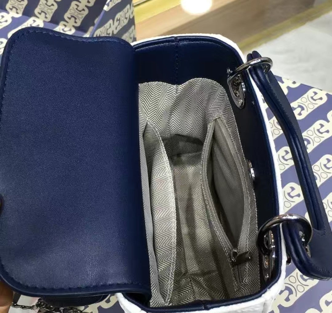 Inside view of GlowBags white and navy mini handbag with spacious compartment