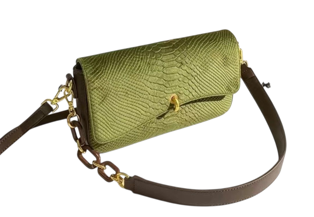 Green textured handbag with a brown strap on a white background