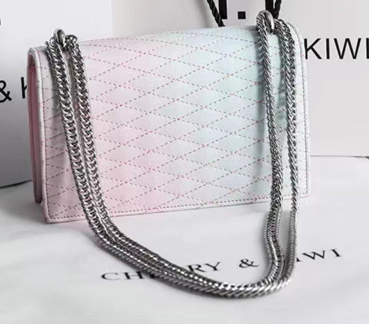 Pink handbag with a chain strap on a white background