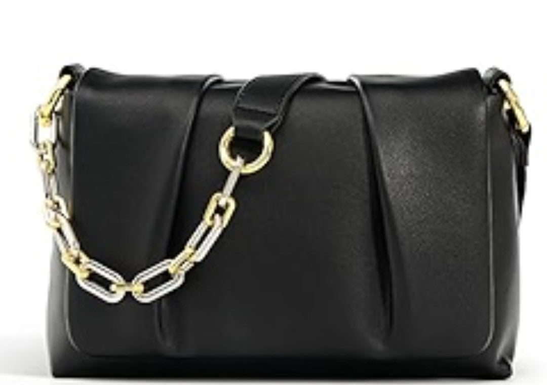 Black handbag with a gold chain detail on a white background