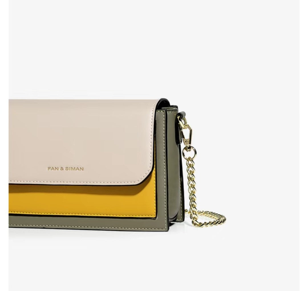 Multicolored handbag with a chain strap on a white background