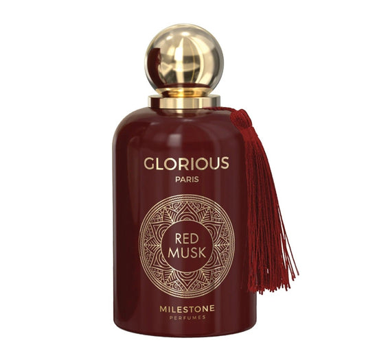 Glorious Paris Red Musk perfume bottle with gold cap and red tassel on a white background