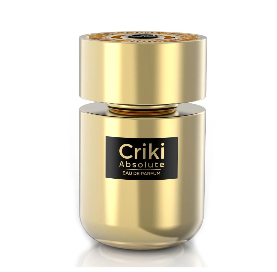 Gold perfume bottle labeled 'Criki Absolute Eau de Parfum' on a white background