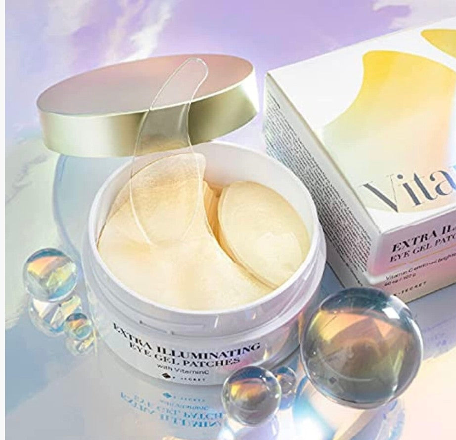 Eye gel patches in a container with a box labeled 'Vita' on a soft focus background.
