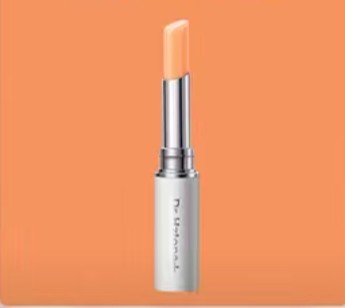 Dr.Hztone+ Colour-Changing Lip Balm in sleek silver tube against orange background. pH & temperature reactive formula for custom natural lip tint.