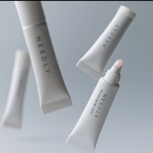 "NEEDLY Sleeping Lip Mask tubes floating against a soft grey background – Korean overnight lip care treatment for hydration and repair."