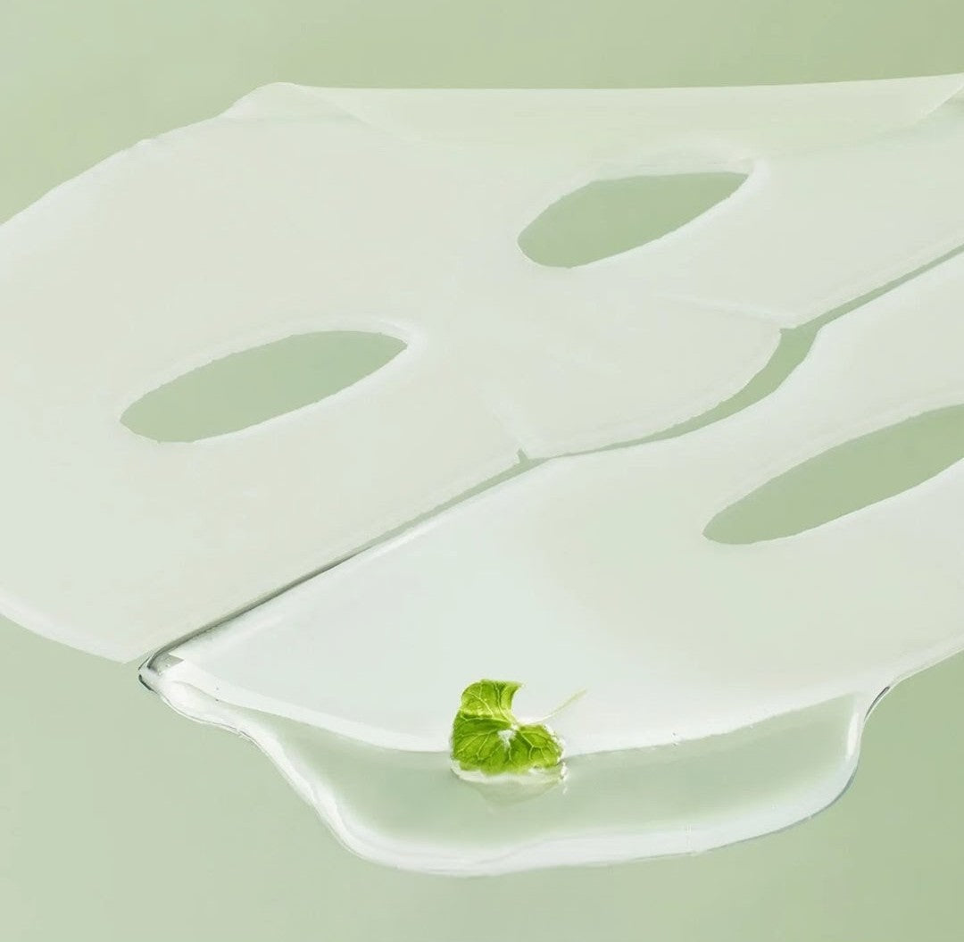 Silicone mold with leaf-shaped cavities on a light green background