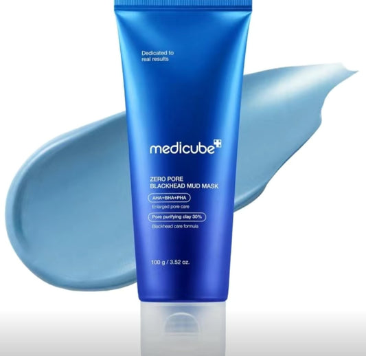 Blue tube of Medicube Zero Pore Blackhead Mud Mask with a smear of mask on a white background