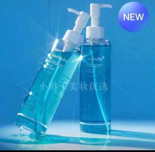 Two blue skincare bottles with pump dispensers on a blue background, featuring the brand 'Medicube'.
