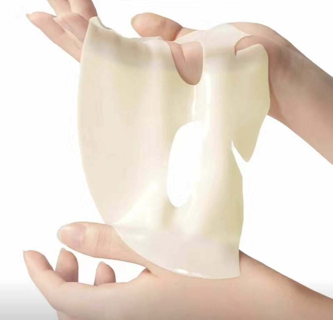 Hands holding a piece of soft, white material against a white background