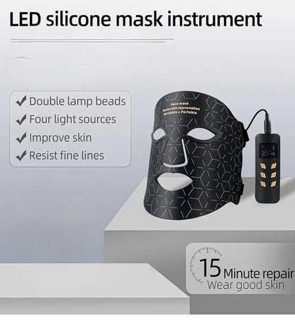 LED silicone mask instrument with power adapter on a gray surface