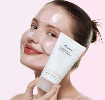 Woman holding a skincare product with a pink background