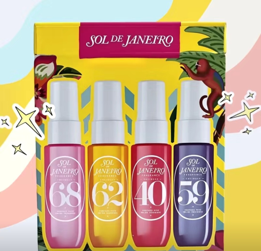 Four Sol de Janeiro perfume bottles with colorful packaging on a decorative background