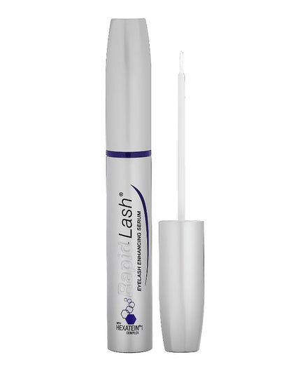 Eyelash serum with applicator on a white background