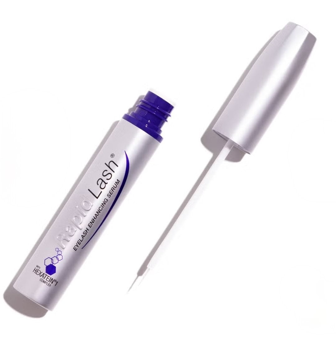 Eyelash serum with applicator on a white background