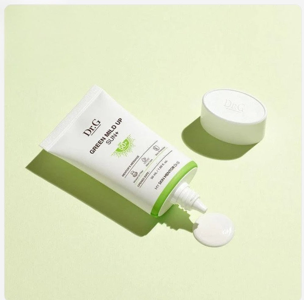 Tube of Dr.G Green Mild Up Sun cream on a light green background