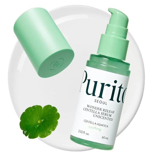 Purito skincare serum bottle with green cap and centella asiatica leaf on a white background