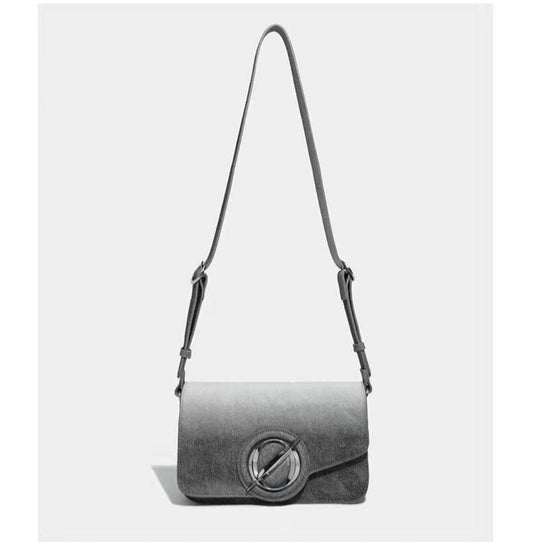 Gray shoulder bag with a circular clasp on a white background