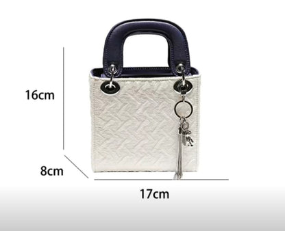 Dimensions of GlowBags white and navy mini handbag – 17cm x 16cm x 8cm
