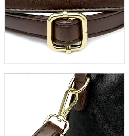 Close-up of a brown leather belt with a gold buckle on a white background.