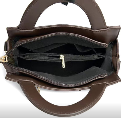 Brown handbag with open compartments on a white background