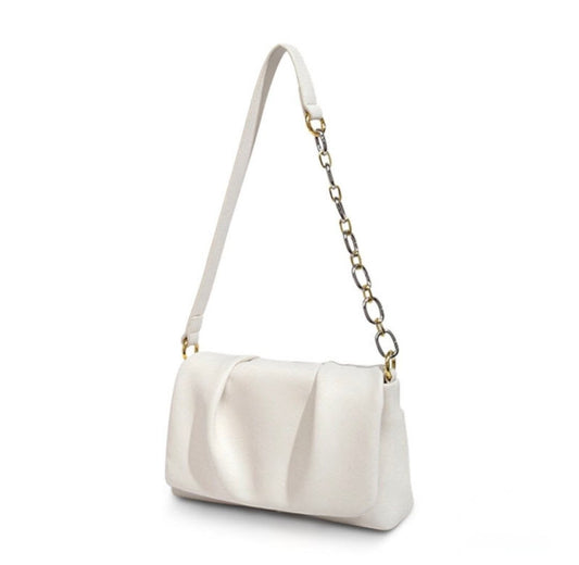White handbag with a chain strap on a white background