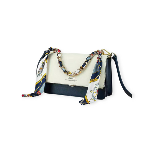White handbag with a colorful scarf draped over it on a white background