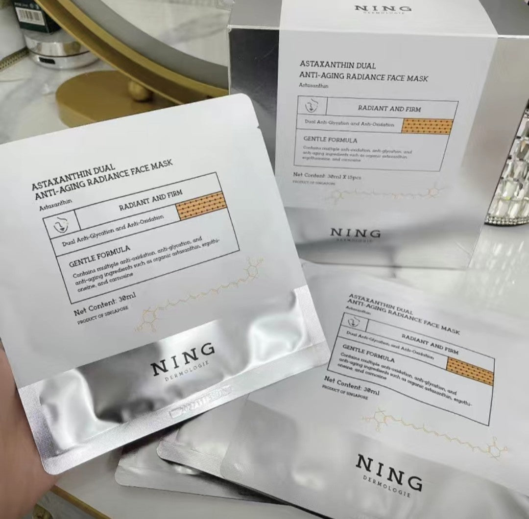 NING Astaxanthin Dual Anti-Aging Radiance Face Mask packaging on a white surface.