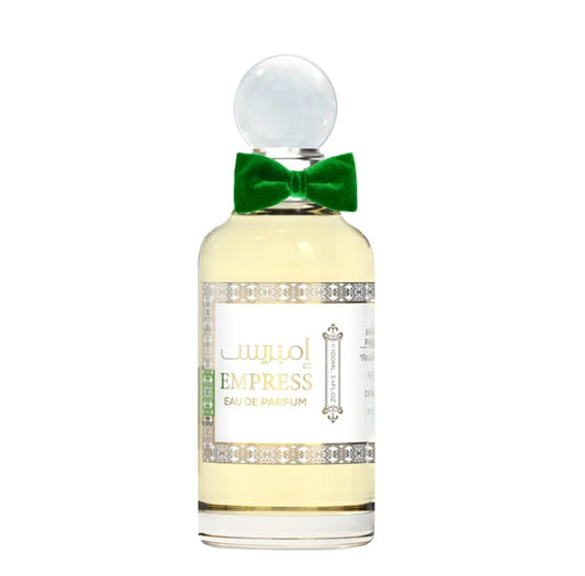 Perfume bottle with a green bow on a white background