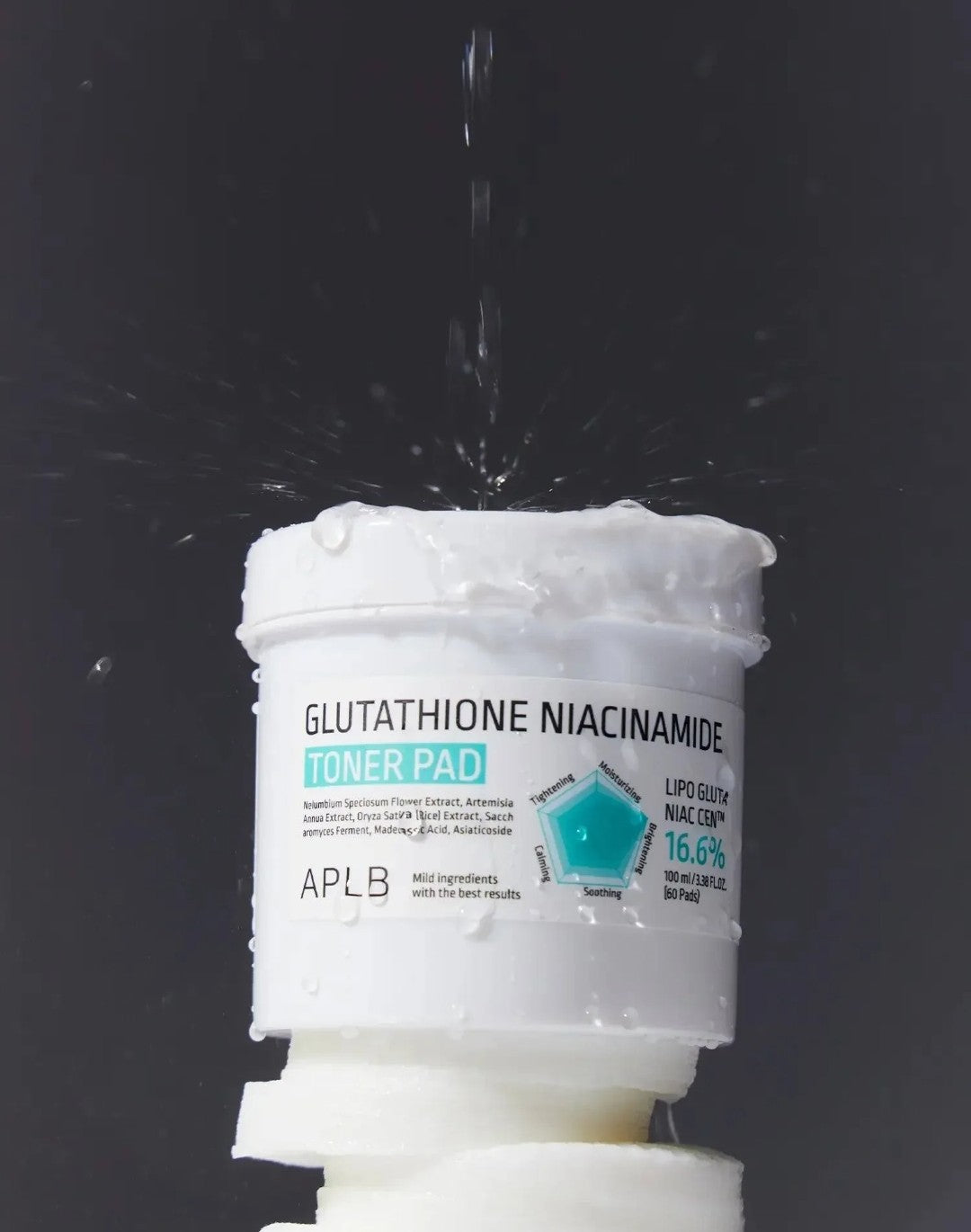 Toner pad with glutathione niacinamide label on a black background