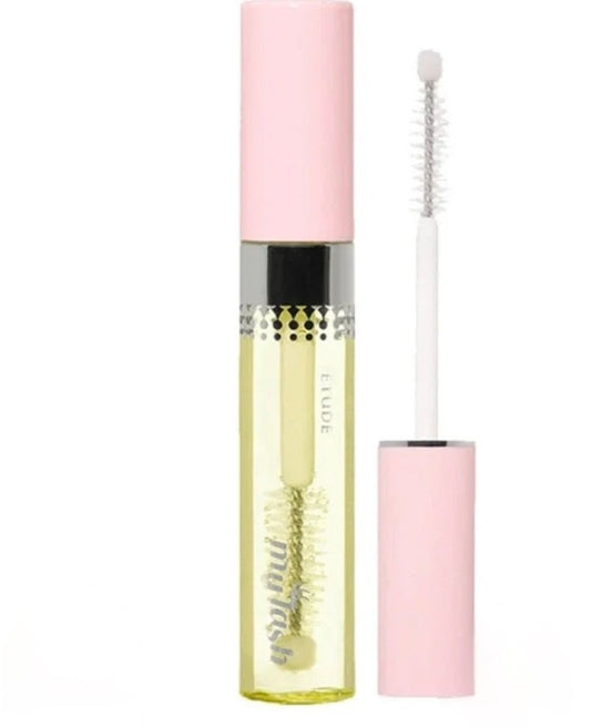 Mascara with pink cap and yellow body on a white background