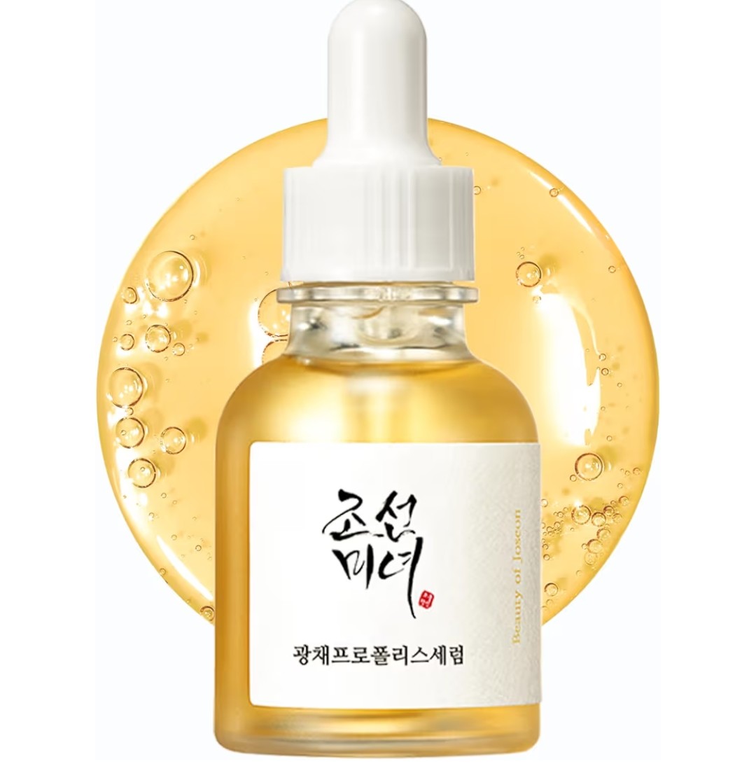 Skincare serum bottle with dropper on a white background