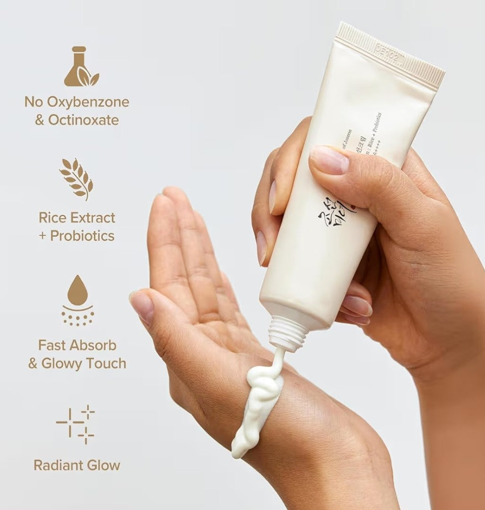Hand applying cream from a tube with text highlighting ingredients and benefits on a light background