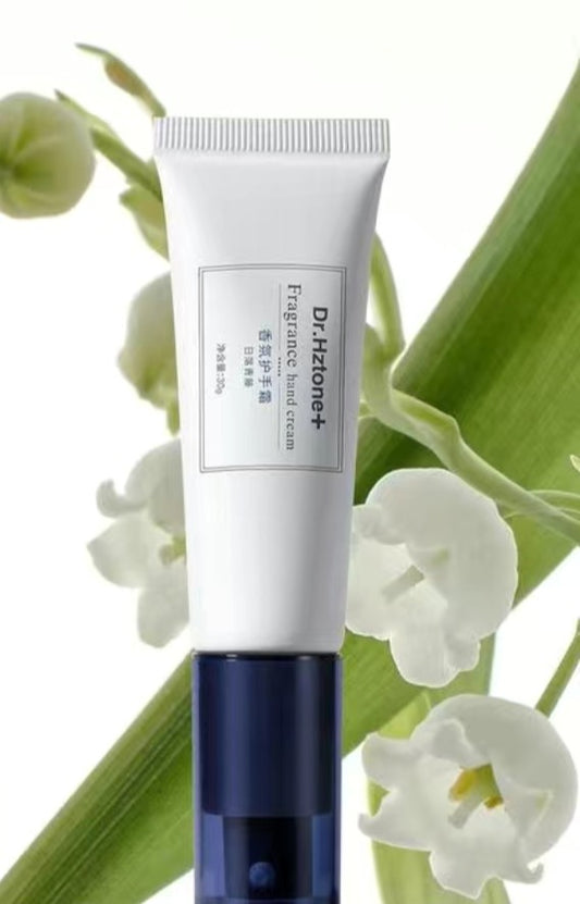 Dr. Herzog skincare cream tube with green leaves and white flowers in the background