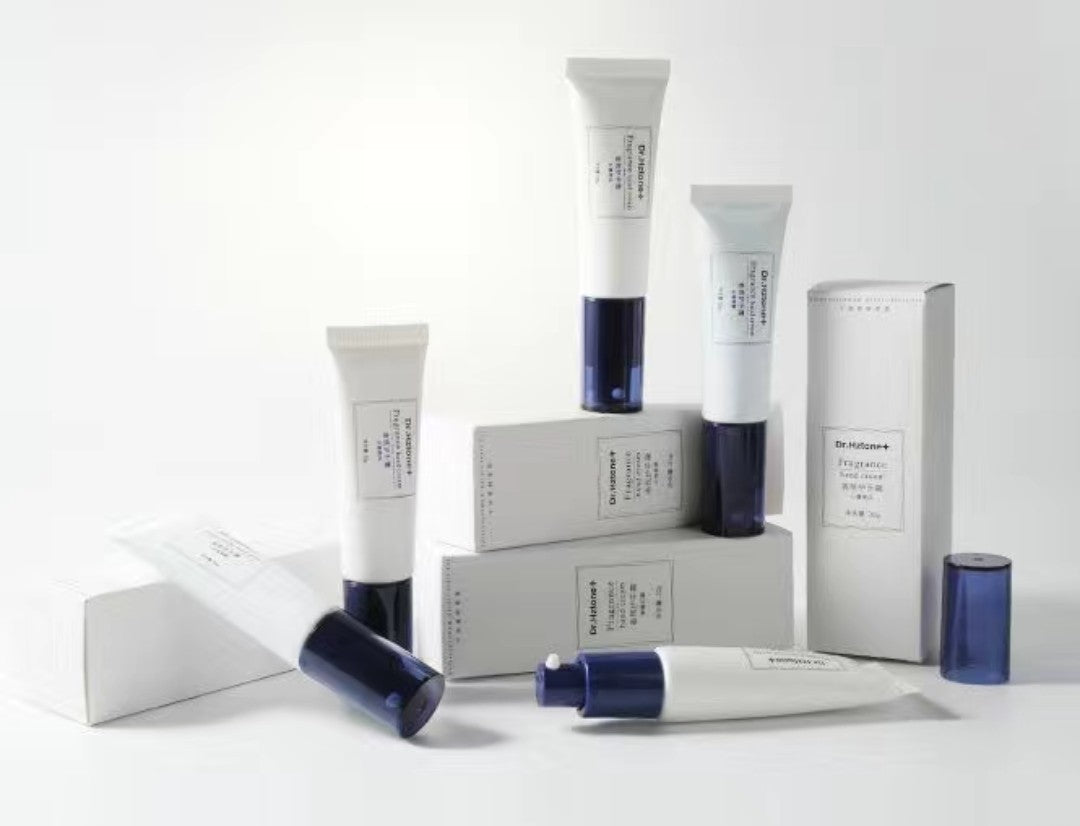Collection of skincare products including tubes and boxes on a white background
