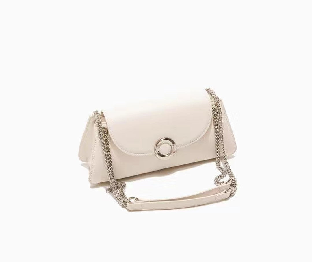 White handbag with a chain strap on a white background