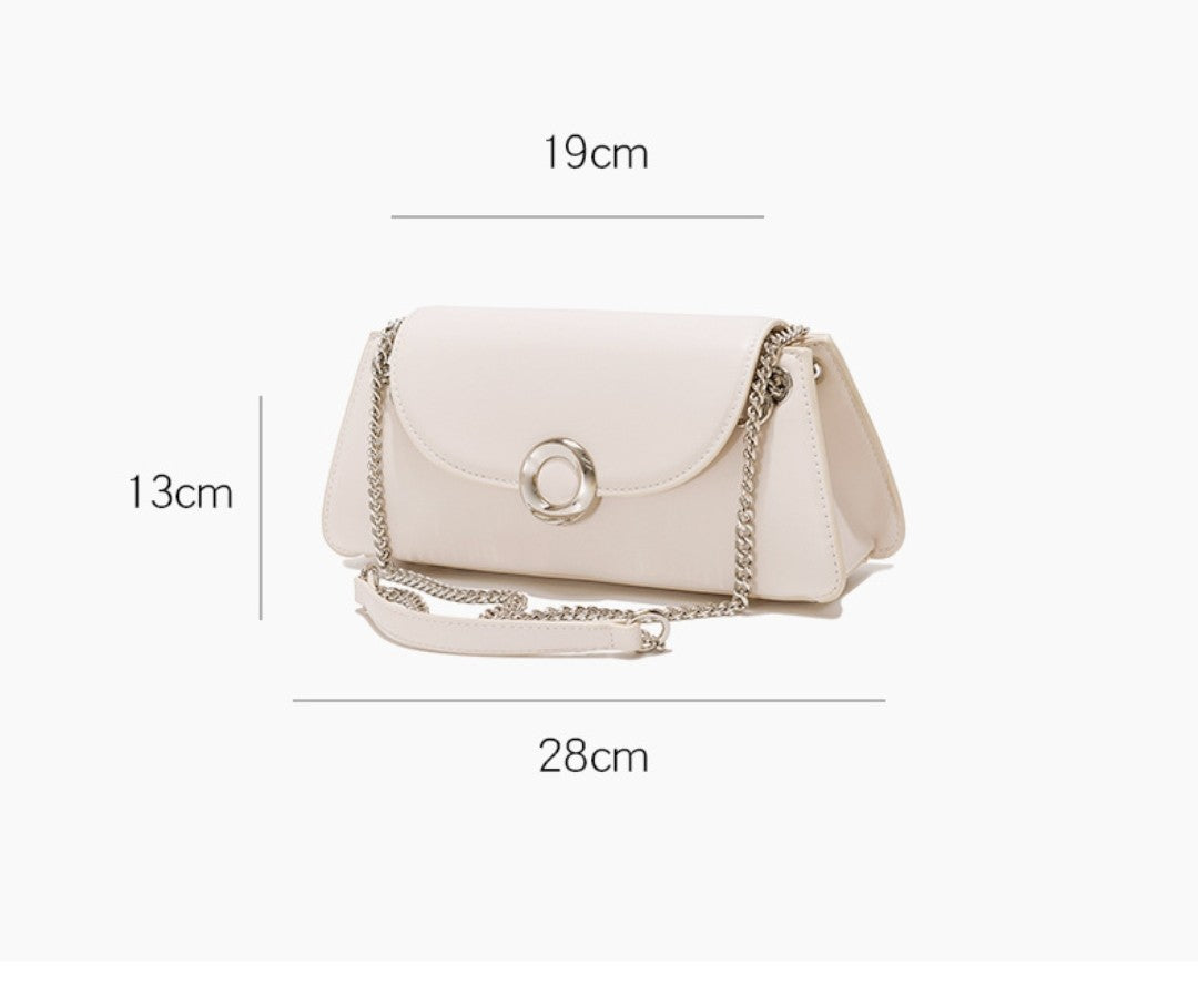 White handbag with chain detail and measurement labels on a white background